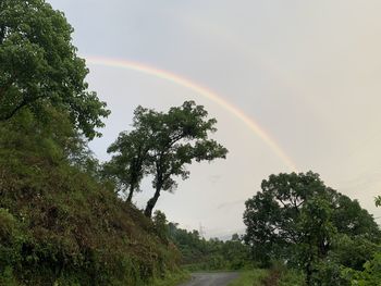 Low angle view of rainbow against sky