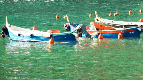 Boats moored in sea