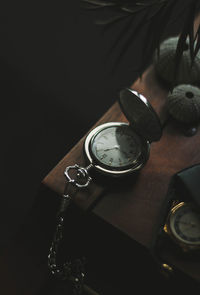 High angle view of clock on table