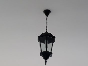 Low angle view of lamp against white background