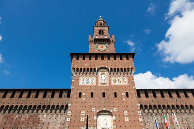 Low angle view of clock tower against sky