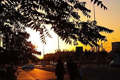 Silhouette of people in city