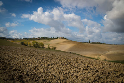 Scenic view of farm against sky