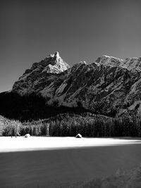 Scenic view of snowcapped mountains against clear sky