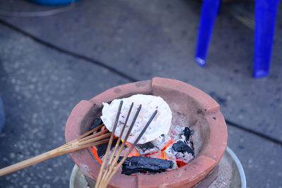 High angle view of cigarette on street