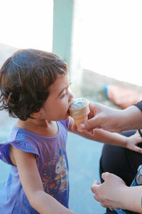 Cute girl drinking water from coffee cup