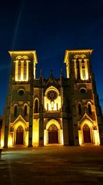 Low angle view of illuminated building at night