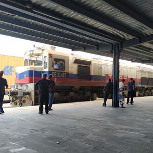 People walking on railroad station platform