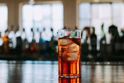 Close-up of beer glass on table