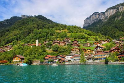 Scenic view of lake and mountains against sky