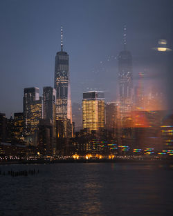 Illuminated buildings in city at night