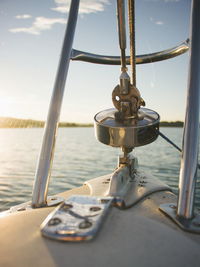 Close-up of ship sailing on sea against sky