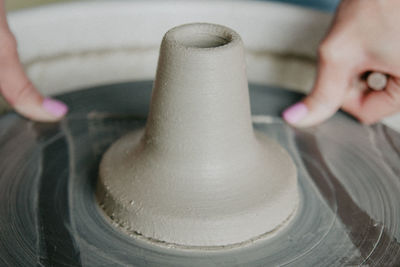 Cropped hand of woman working in workshop