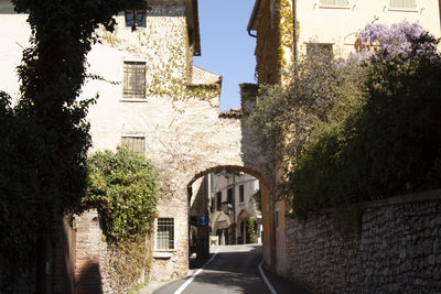 Street amidst buildings against sky