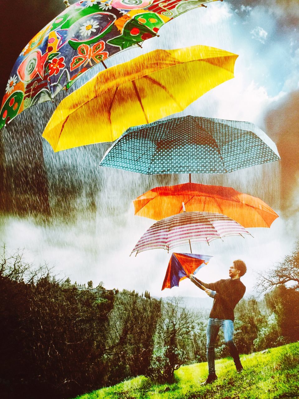 lifestyles, leisure activity, standing, full length, men, umbrella, rear view, multi colored, casual clothing, childhood, yellow, person, holding, nature, day, grass, field, boys