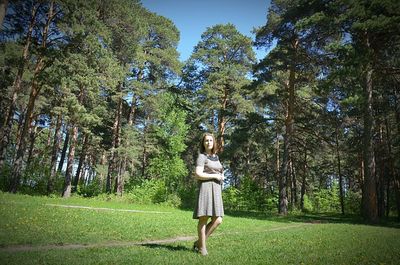 Full length of woman standing on field