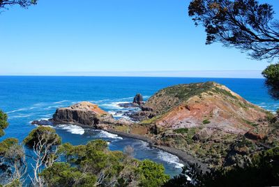 Scenic view of sea against clear blue sky