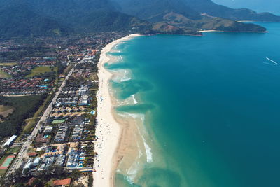 High angle view of sea and buildings in city