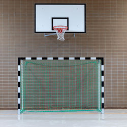 Low angle view of basketball hoop against wall
