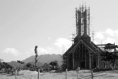 Abandoned built structure on landscape against the sky