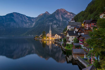 Panoramic view of lake and buildings against sky