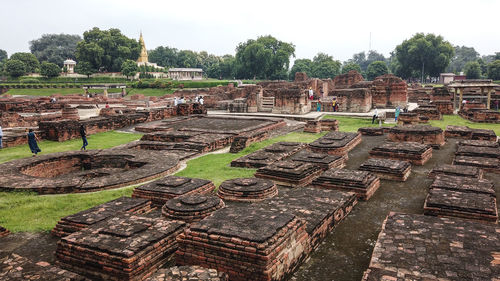 Old ruins on field against sky