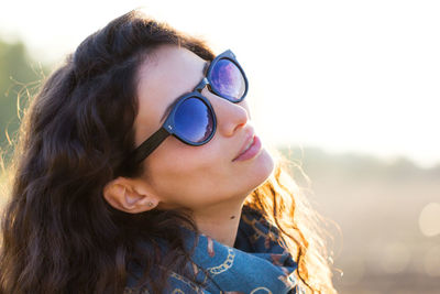 Portrait of young woman wearing sunglasses