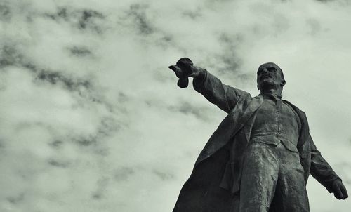 Low angle view of statue against cloudy sky