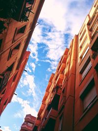Low angle view of building against cloudy sky