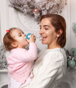 Mother and daughter smiling