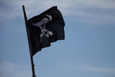 Low angle view of sculpture against blue sky