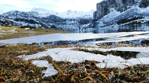 Scenic view of snow covered field and mountains