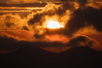 Low angle view of dramatic sky at sunset