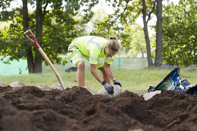 Female worker doing landscaping work