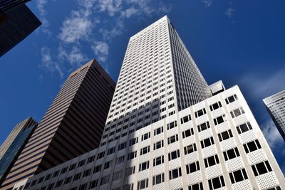 Low angle view of modern buildings against sky in city