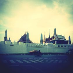 View of buildings against cloudy sky