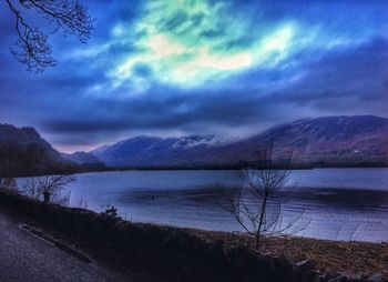 Scenic view of lake against dramatic sky