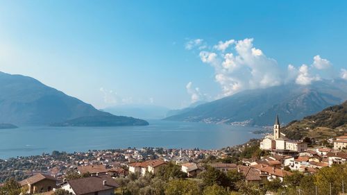 Panoramic shot of townscape by sea against sky