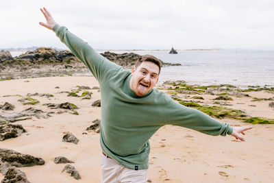 Young woman standing at beach