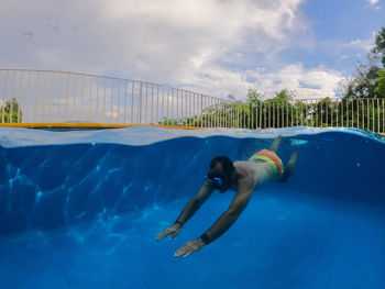 Man swimming in pool