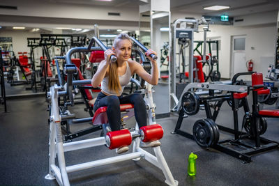 Side view of man exercising in gym