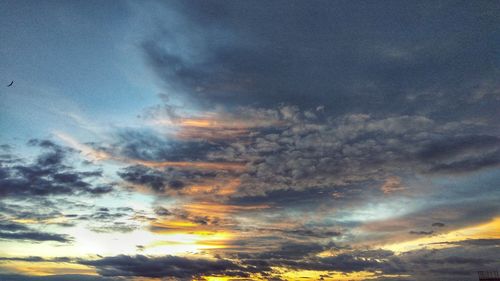 Low angle view of dramatic sky during sunset