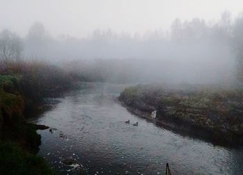 Scenic view of river passing through landscape