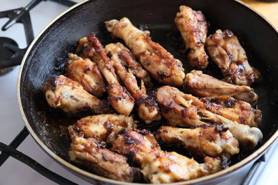 High angle view of meat in cooking pan