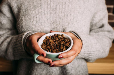 Midsection of woman holding food