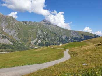 Scenic view of landscape and mountains against sky