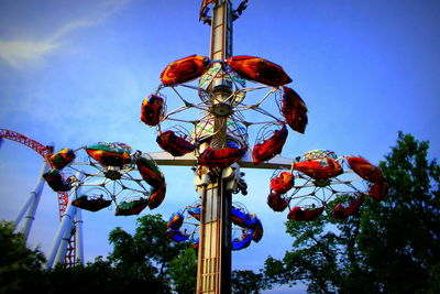 Low angle view of lanterns hanging against sky