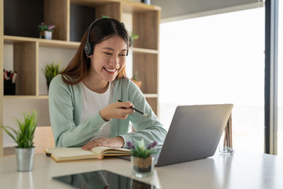 Businesswoman working at table