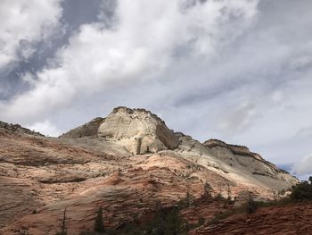 Low angle view of rock formations against sky