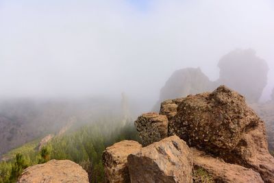 Rocks on mountain against sky